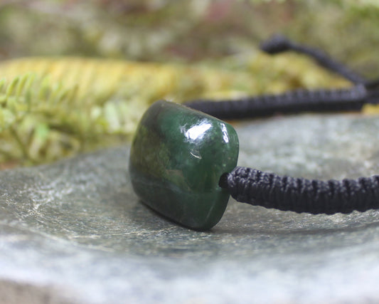 Adjustable cord bracelet with Rimu Pounamu