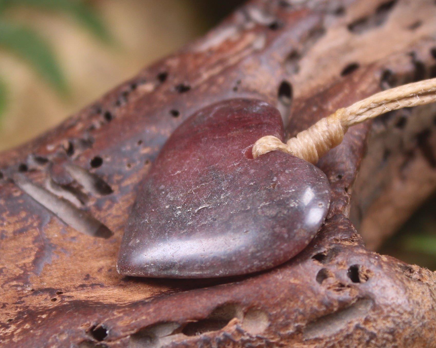 Heart carved from Rhodonite 