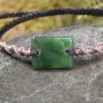 Adjustable cord bracelet with Kawakawa Pounamu