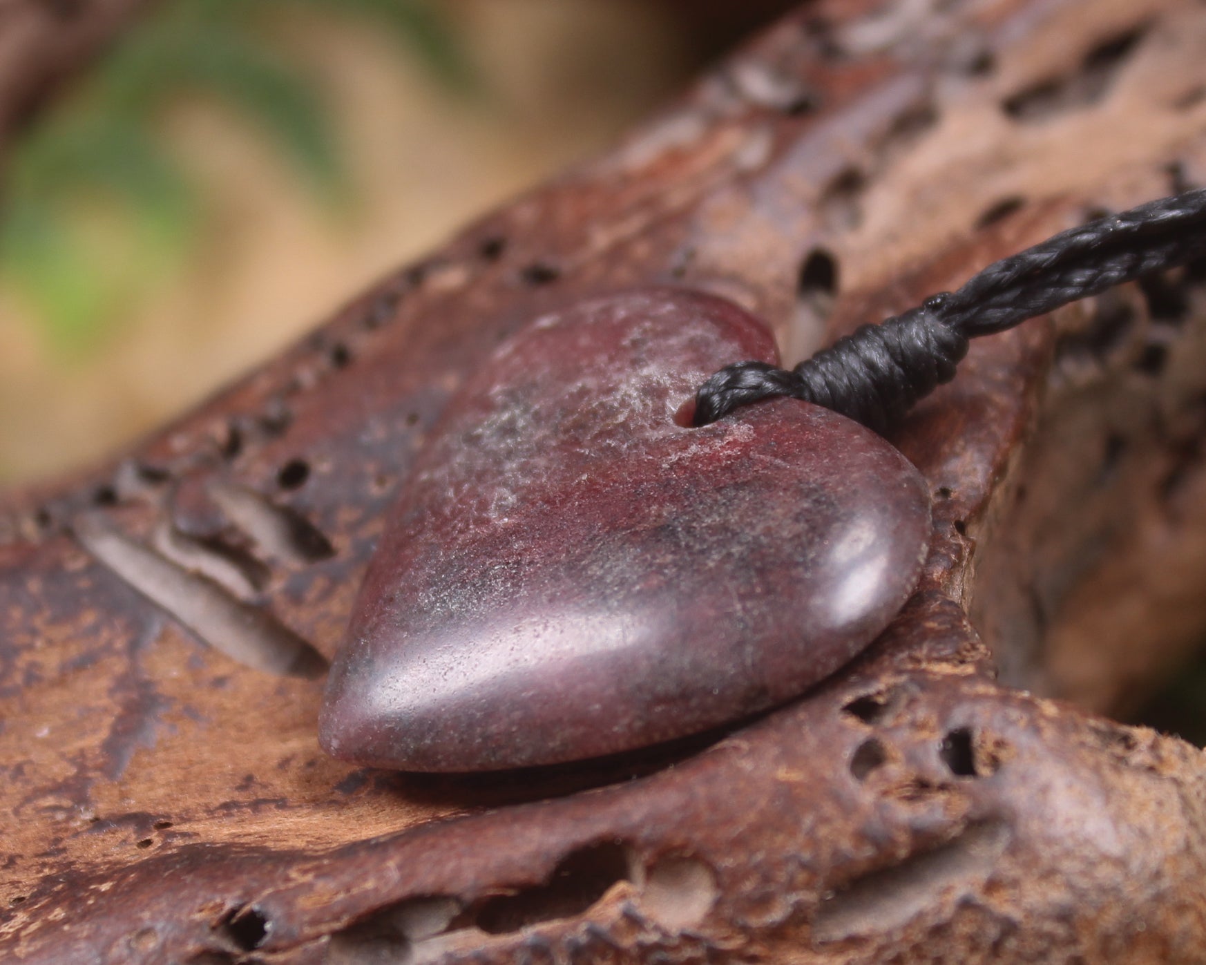 Heart carved from Rhodonite 