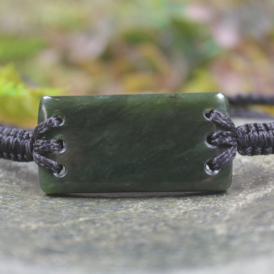 Adjustable cord bracelet with Rimu Pounamu