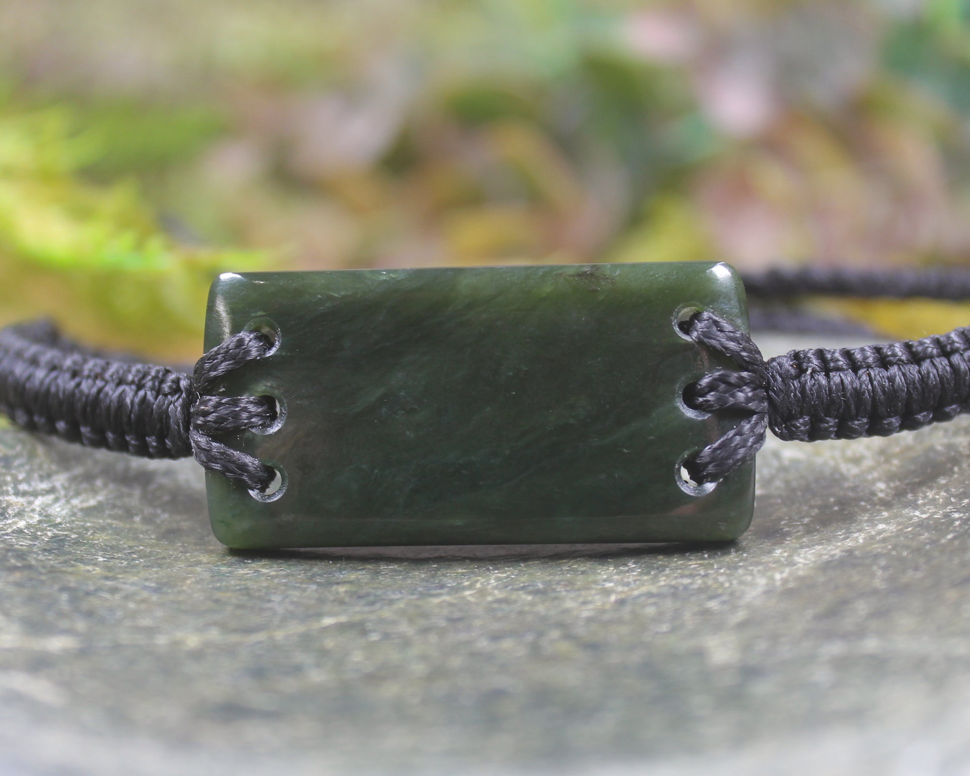 Adjustable cord bracelet with Rimu Pounamu