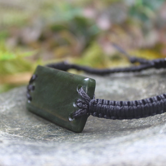 Adjustable cord bracelet with Rimu Pounamu