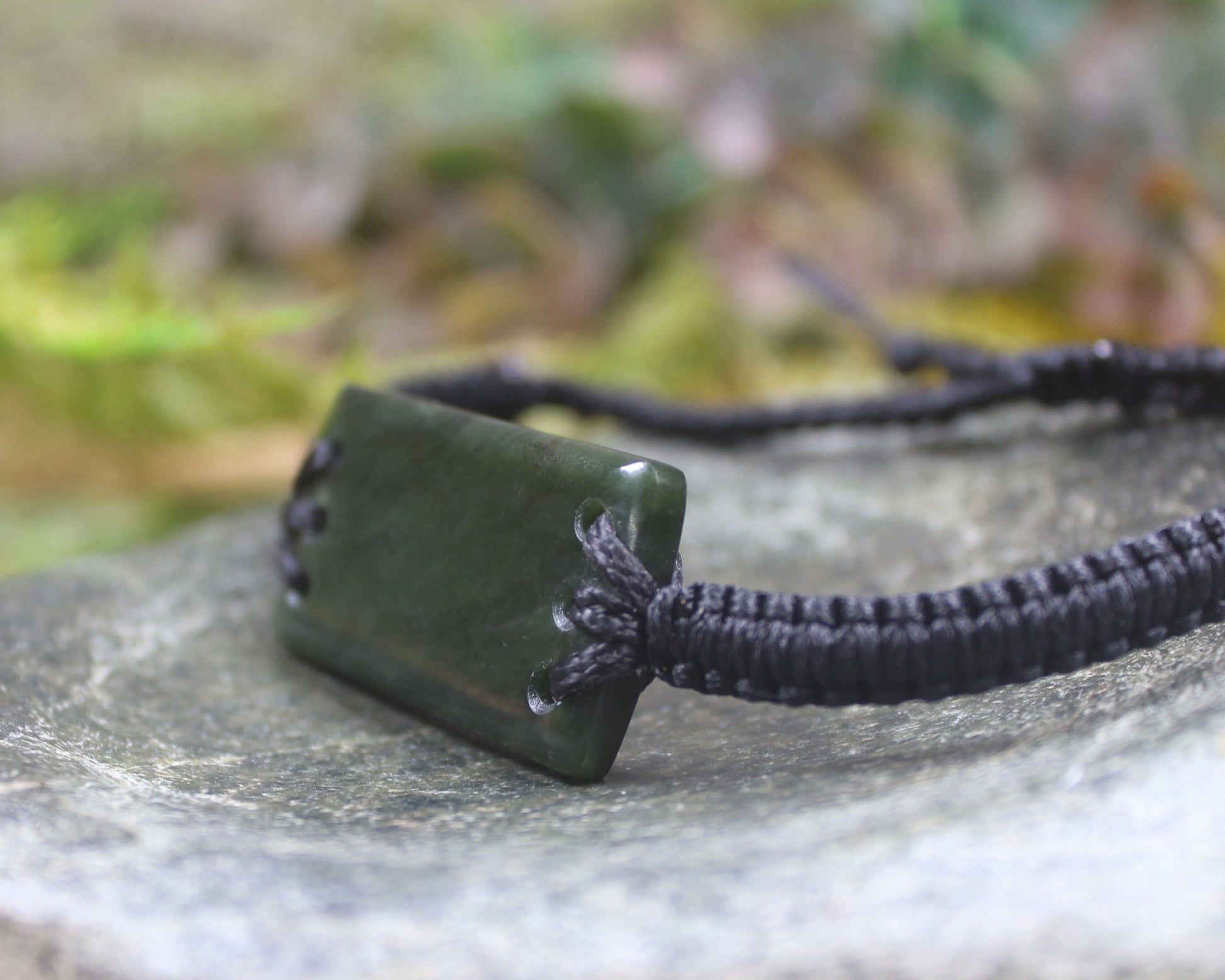 Adjustable cord bracelet with Rimu Pounamu