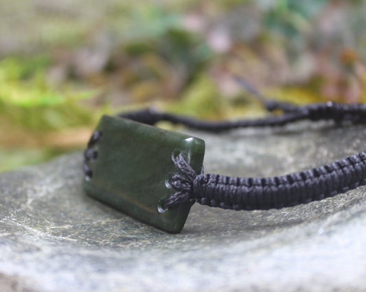 Adjustable cord bracelet with Rimu Pounamu
