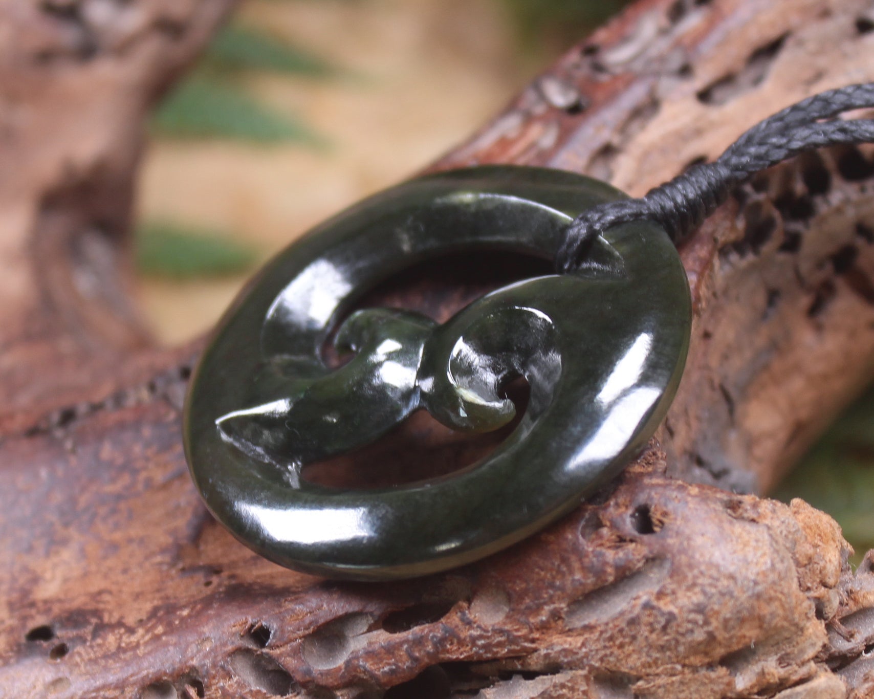 Koru carved from Rimu Pounamu - NZ Greenstone