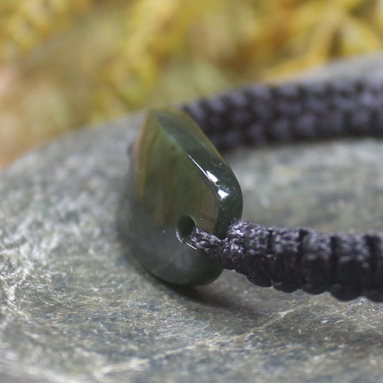 Adjustable cord bracelet with Rimu Pounamu