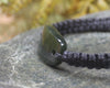 Adjustable cord bracelet with Rimu Pounamu