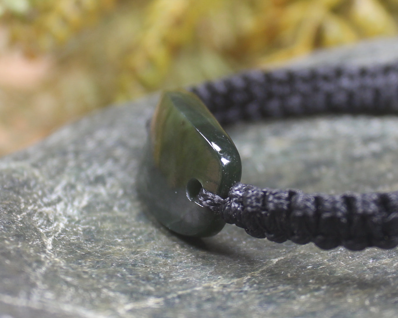 Adjustable cord bracelet with Rimu Pounamu