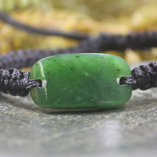 Adjustable cord bracelet with Hapopo Pounamu