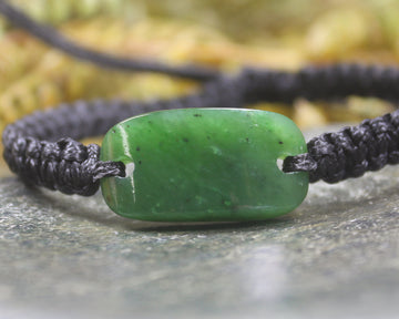 Adjustable cord bracelet with Hapopo Pounamu
