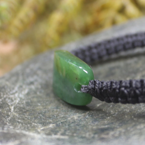 Adjustable cord bracelet with Hapopo Pounamu