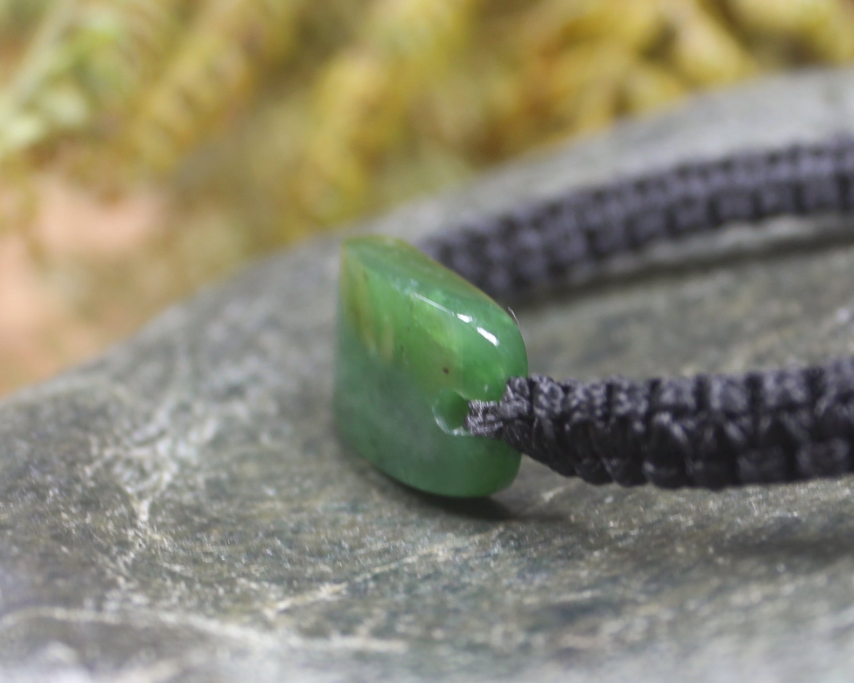 Adjustable cord bracelet with Hapopo Pounamu