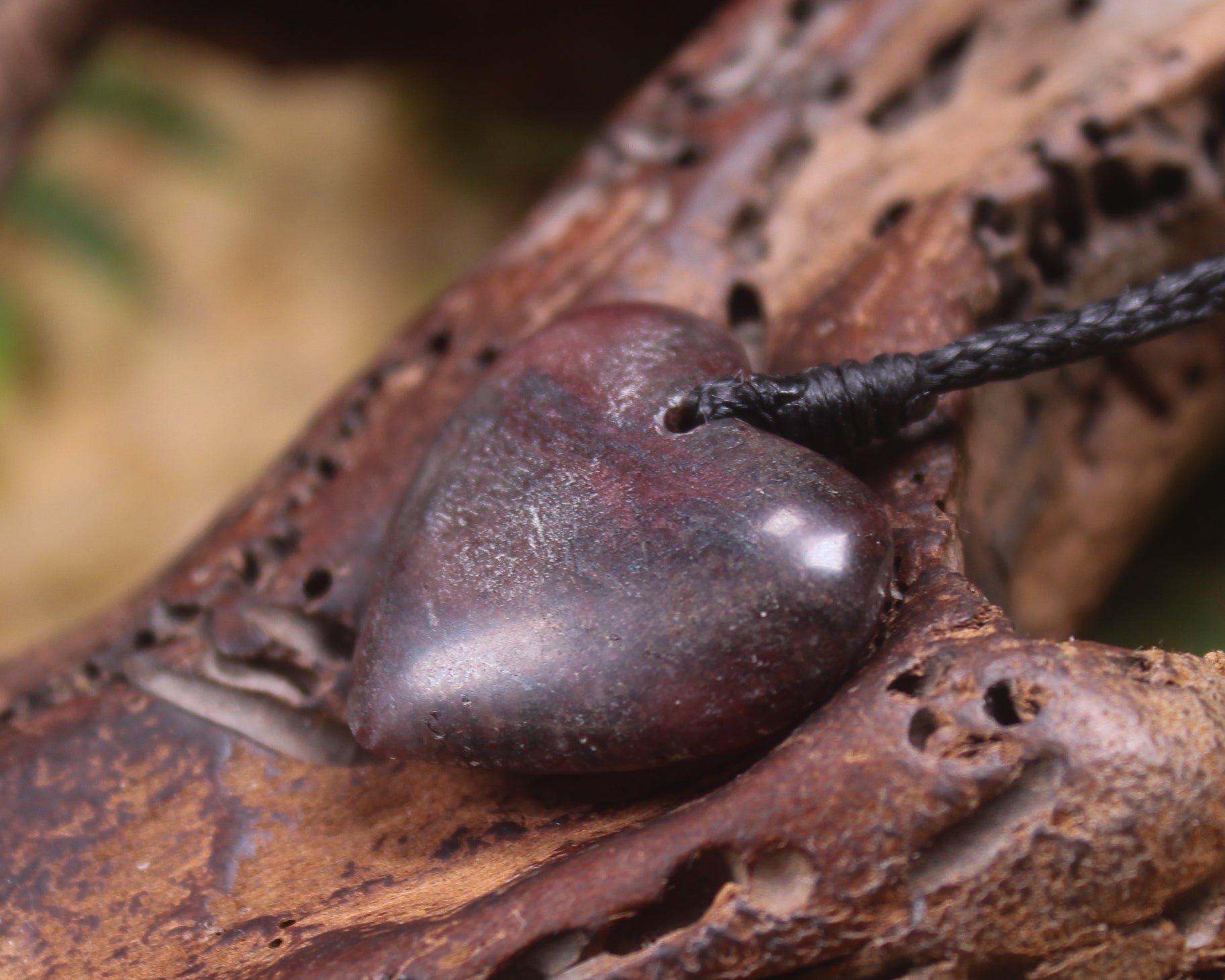 Heart carved from Rhodonite 