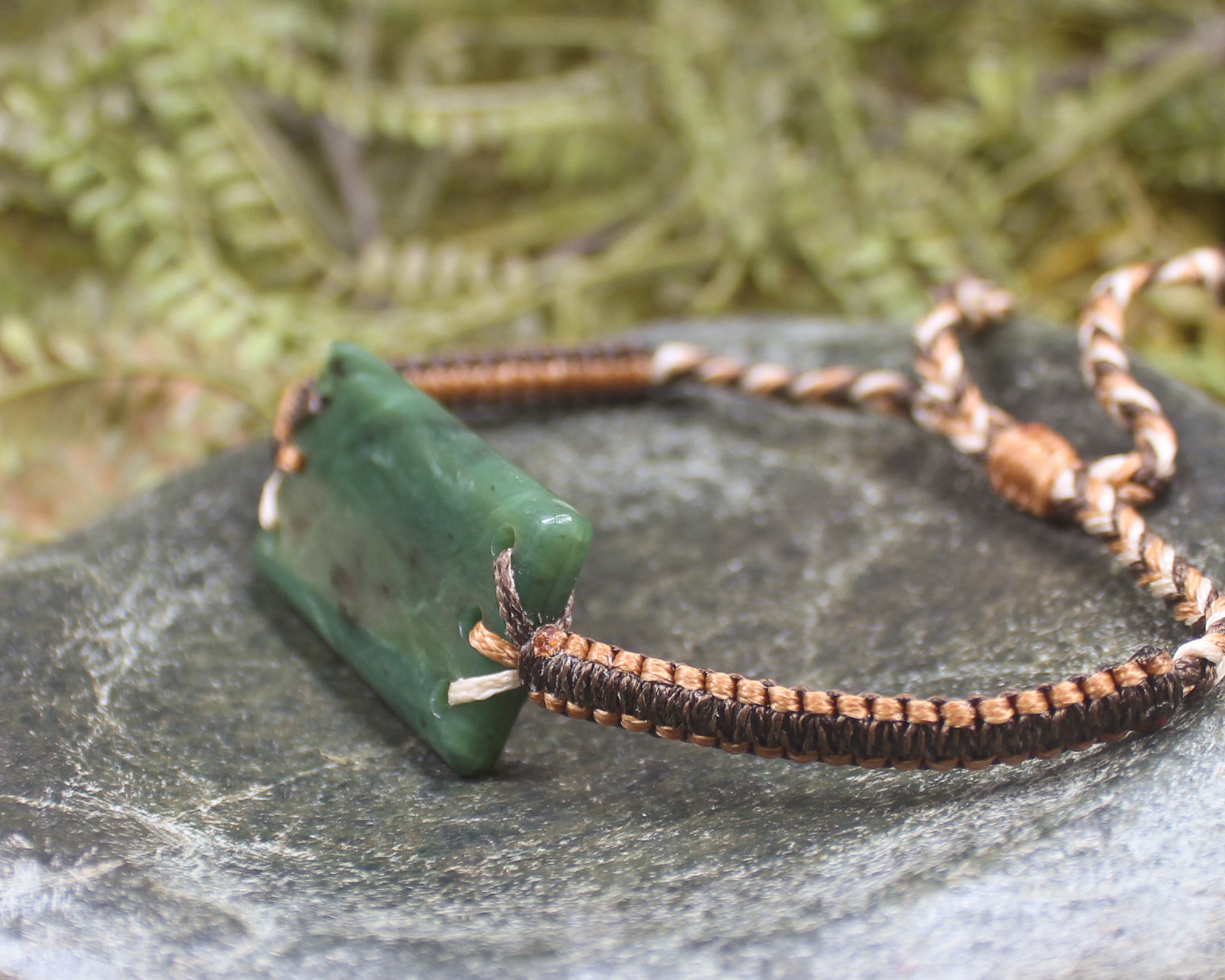 Adjustable cord bracelet with Hapopo Pounamu
