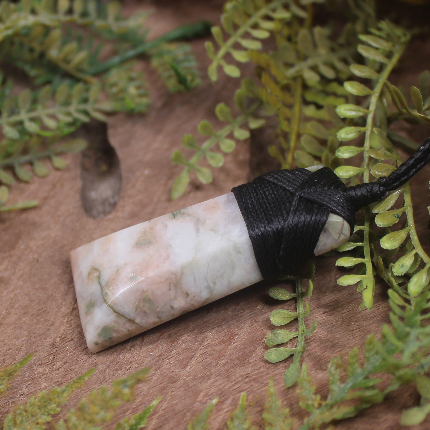Thulite in quartz toki pendant