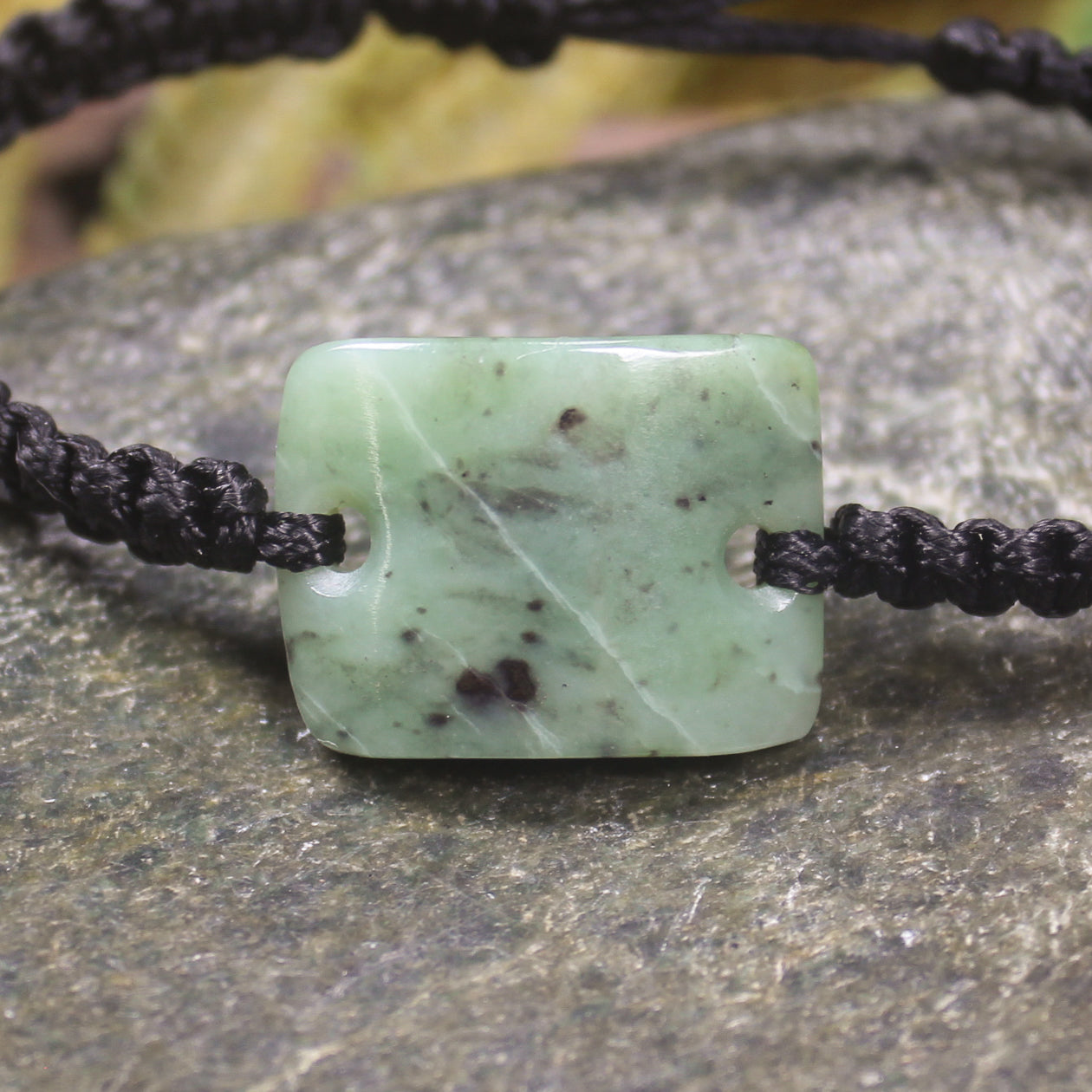 Adjustable cord bracelet with Hapopo Pounamu