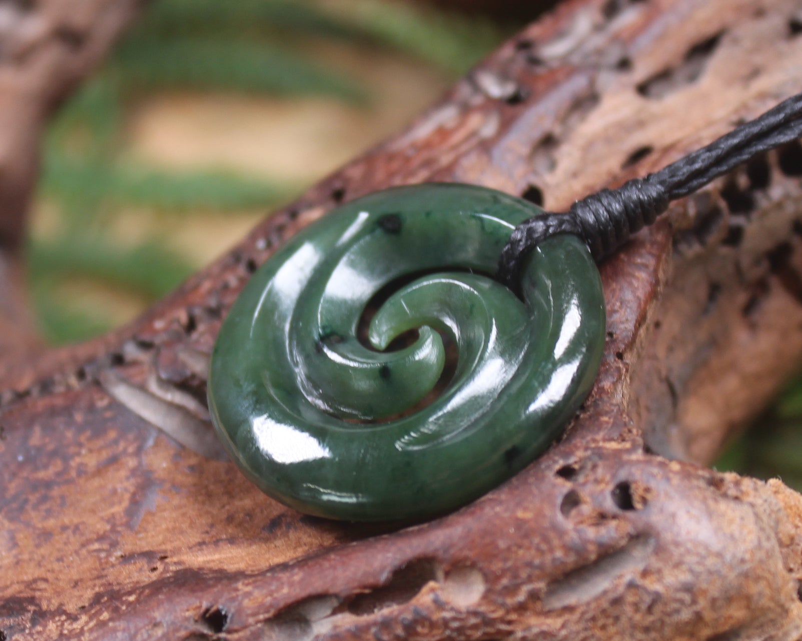 Koru pendant carved from Kawakawa Pounamu - NZ Greenstone