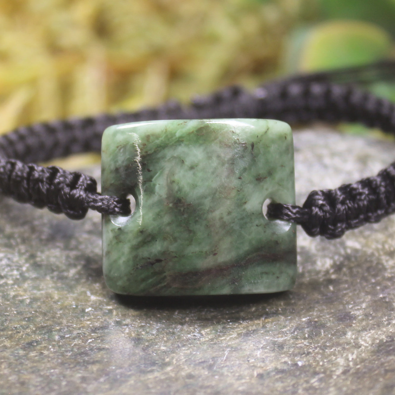 Adjustable cord bracelet with Hapopo Pounamu