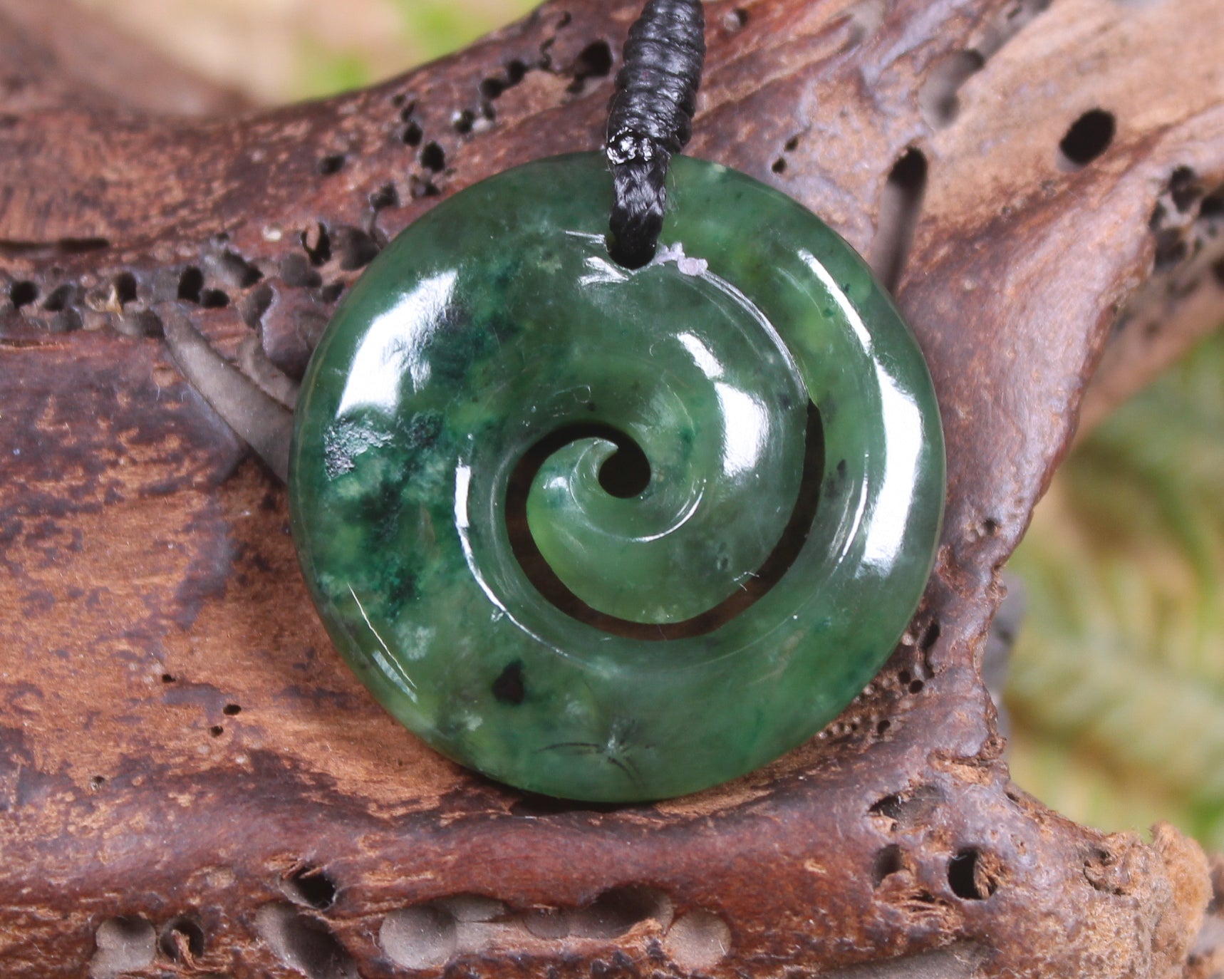 Koru pendant carved from Kawakawa Pounamu - NZ Greenstone