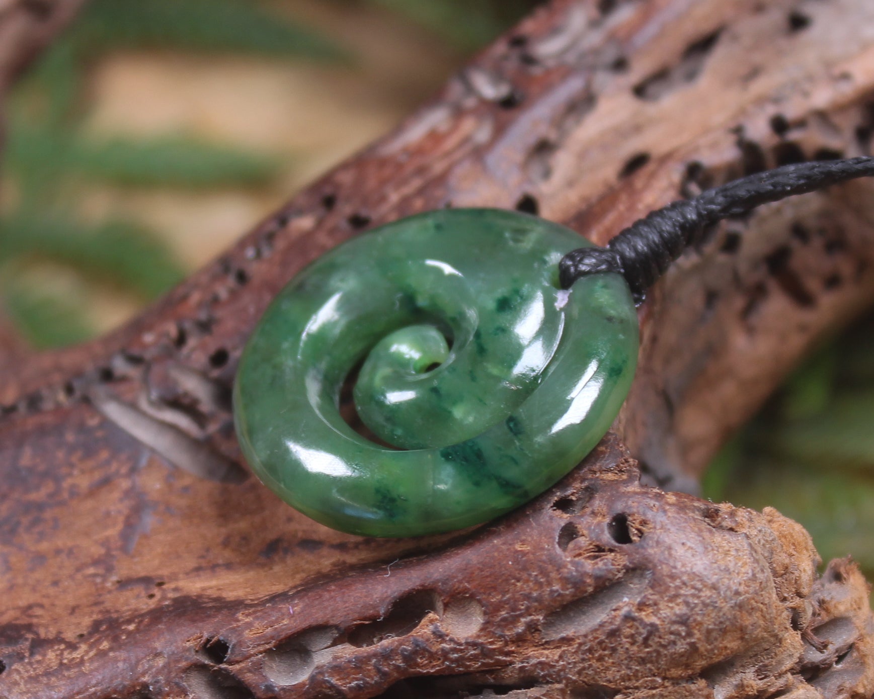 Koru pendant carved from Kawakawa Pounamu - NZ Greenstone