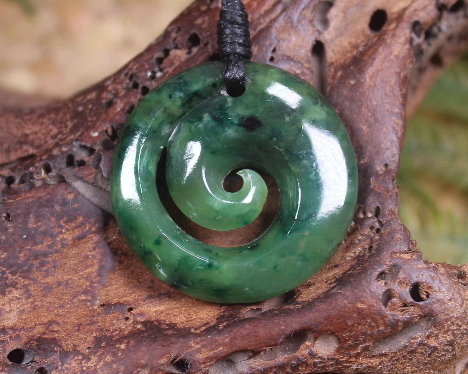 Koru pendant carved from Kawakawa Pounamu - NZ Greenstone