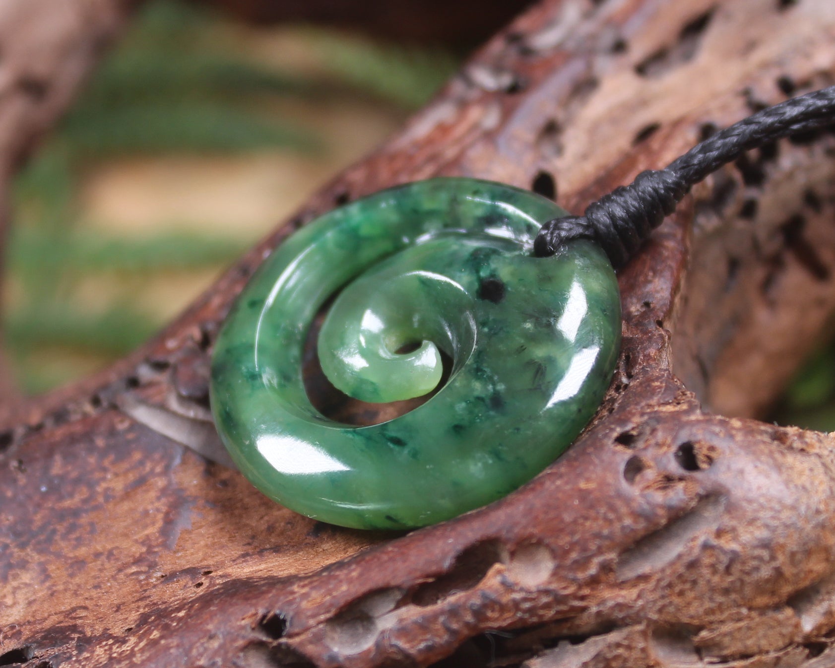 Koru pendant carved from Kawakawa Pounamu - NZ Greenstone