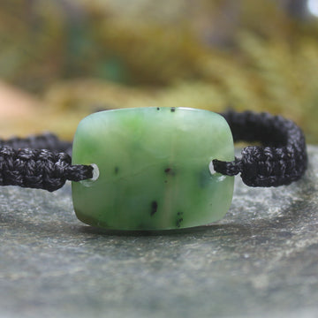 Adjustable cord bracelet with Hapopo Pounamu