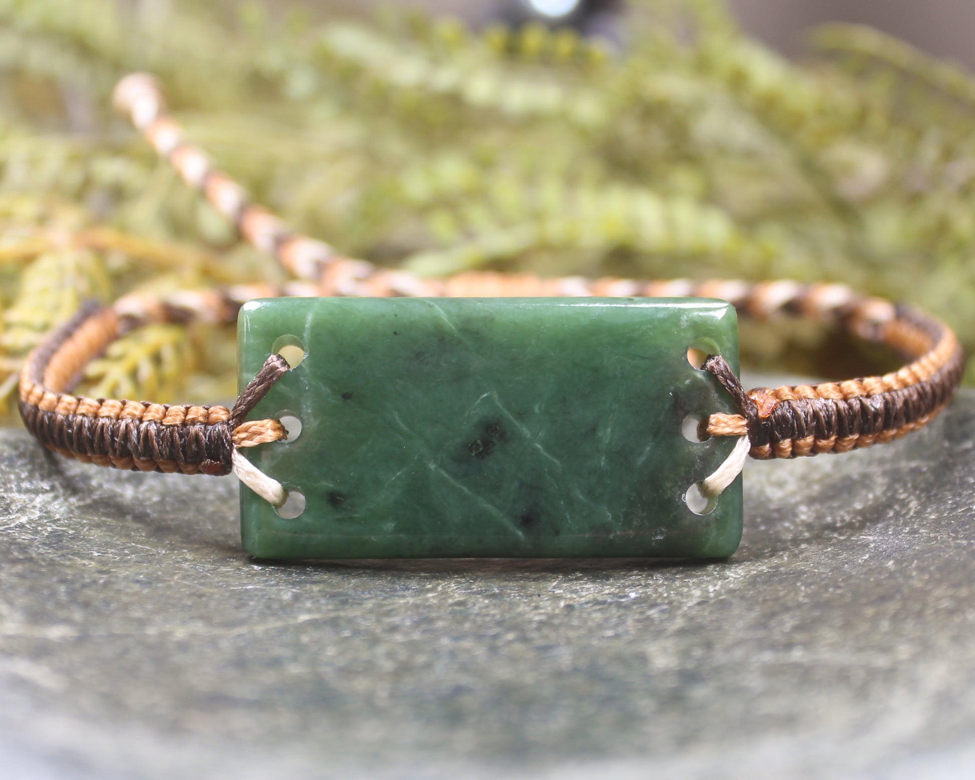 Adjustable cord bracelet with Hapopo Pounamu