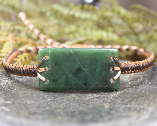 Adjustable cord bracelet with Hapopo Pounamu