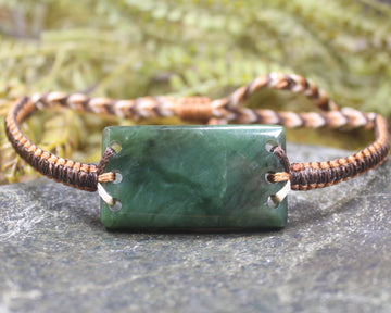 Adjustable cord bracelet with Hapopo Pounamu