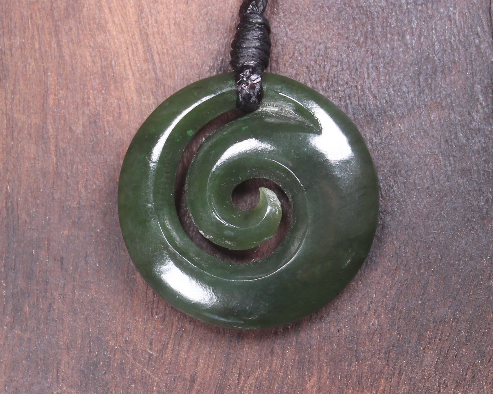 Koru pendant carved from Kawakawa Pounamu - NZ Greenstone