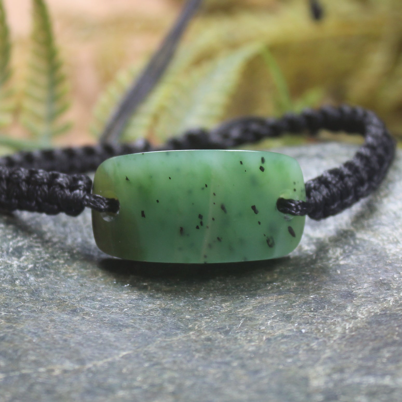 Adjustable cord bracelet with Hapopo Pounamu