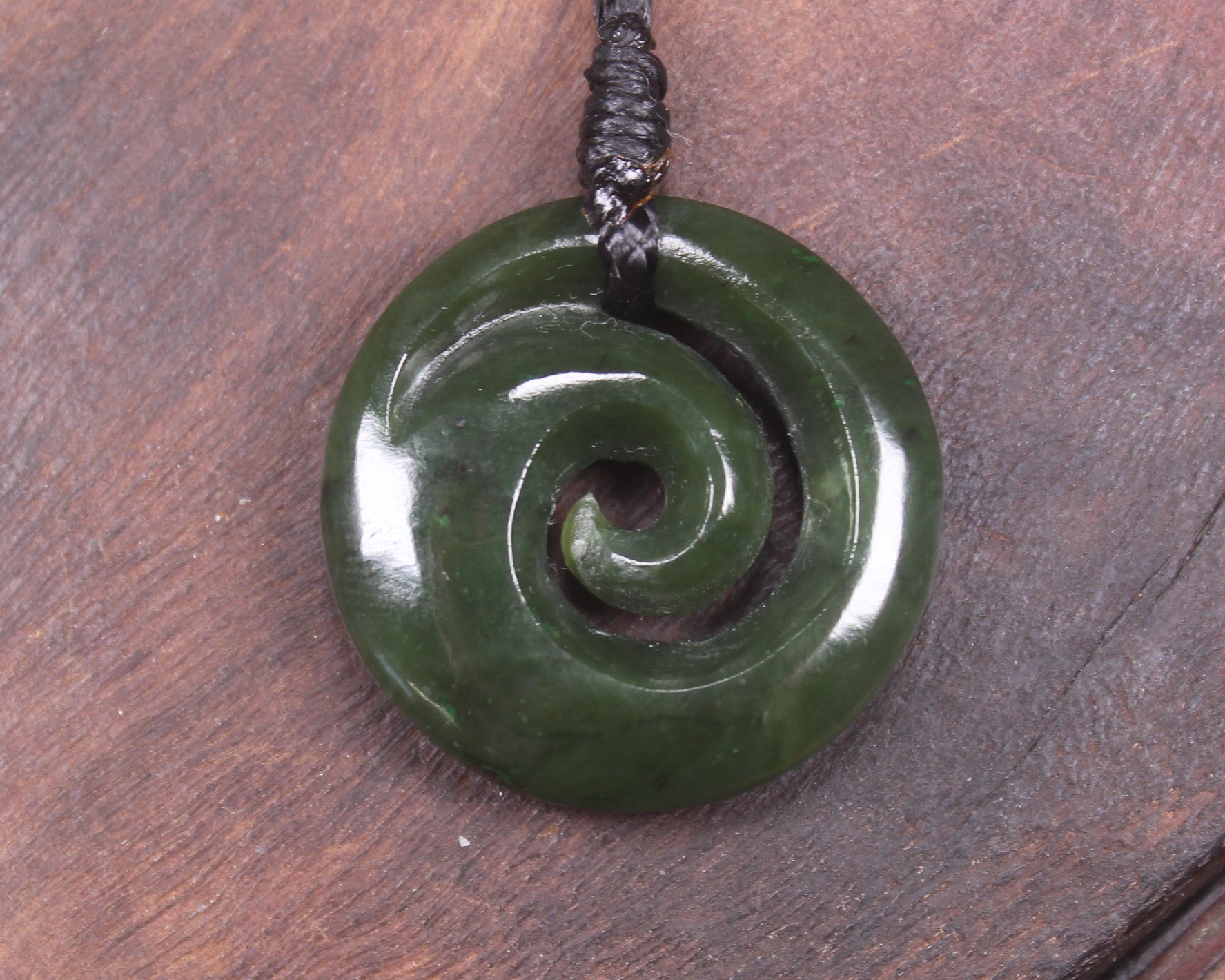 Koru pendant carved from Kawakawa Pounamu - NZ Greenstone