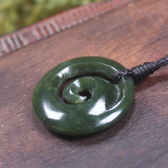 Koru pendant carved from Kawakawa Pounamu - NZ Greenstone