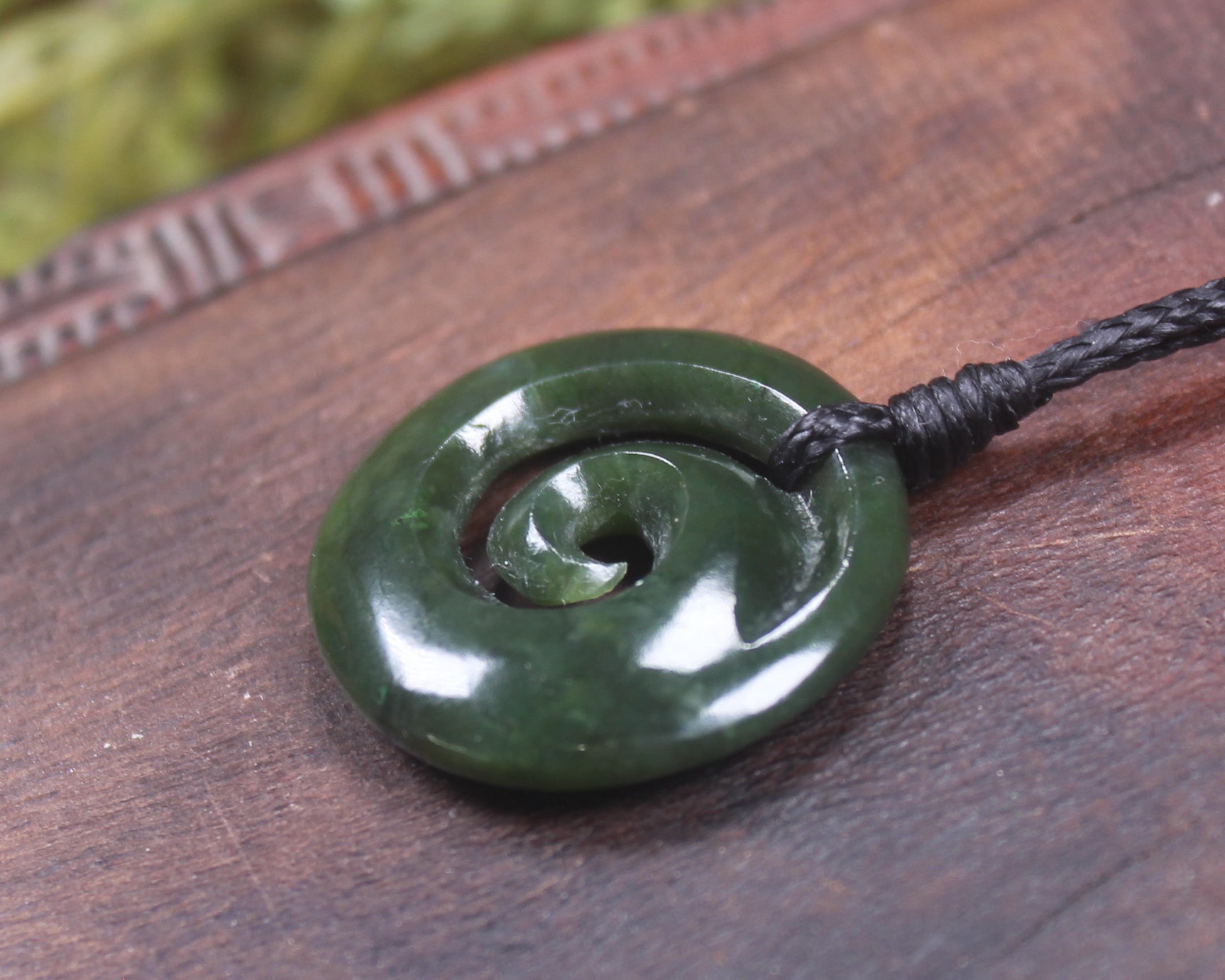 Koru pendant carved from Kawakawa Pounamu - NZ Greenstone