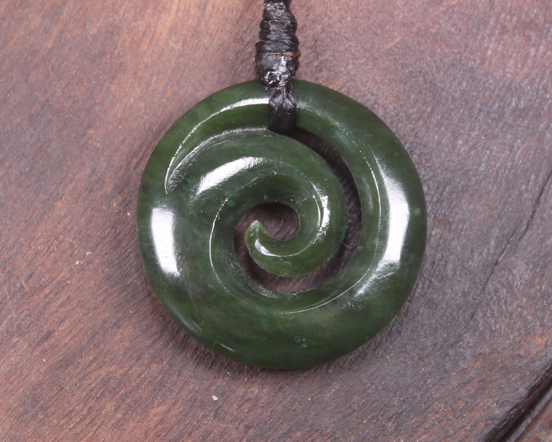 Koru pendant carved from Kawakawa Pounamu - NZ Greenstone