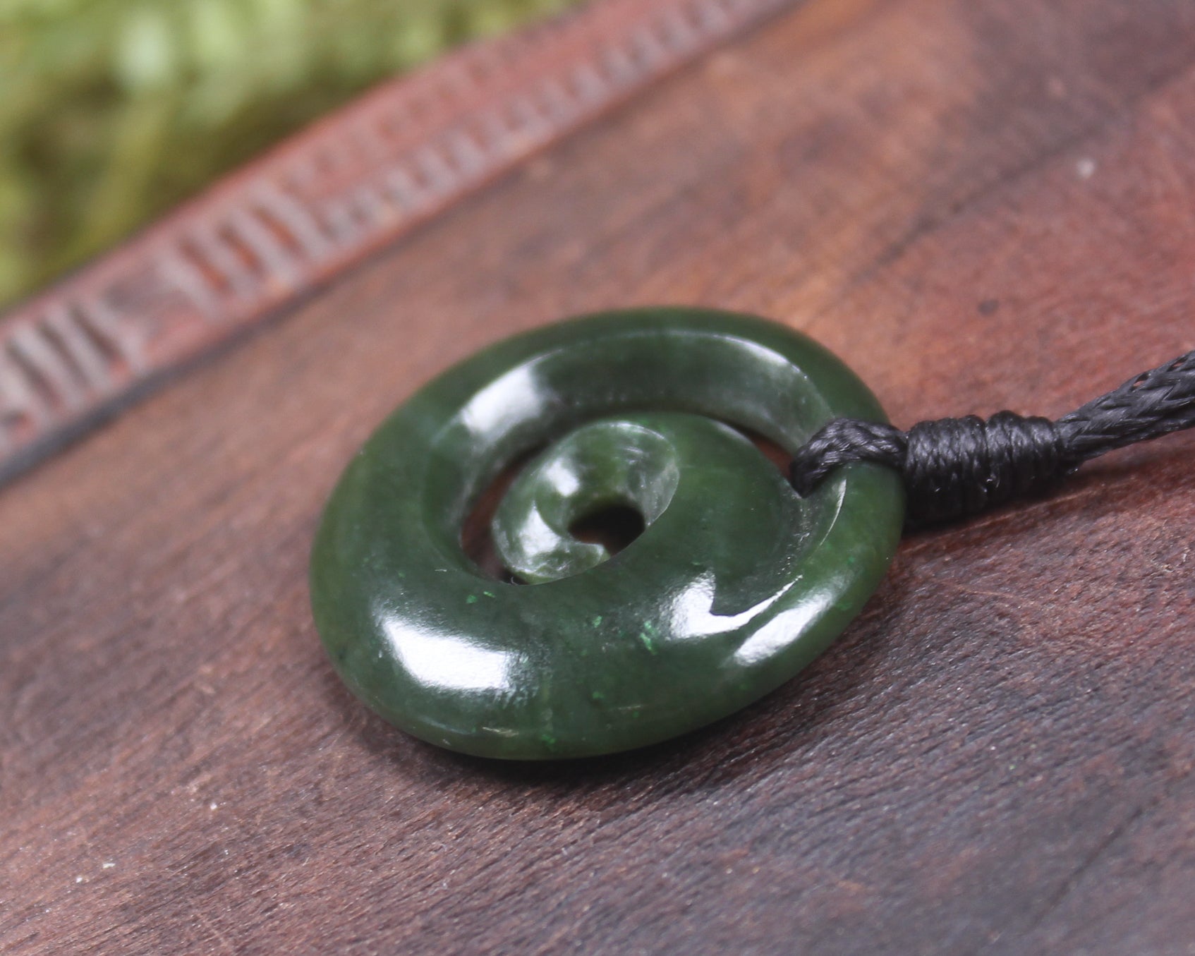 Koru pendant carved from Kawakawa Pounamu - NZ Greenstone