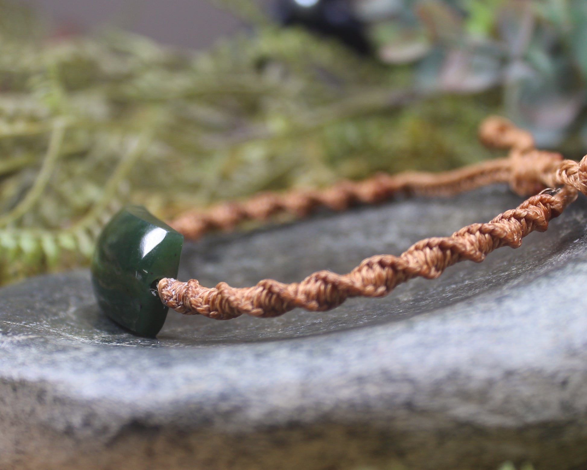 Adjustable cord bracelet with Kawakawa Pounamu