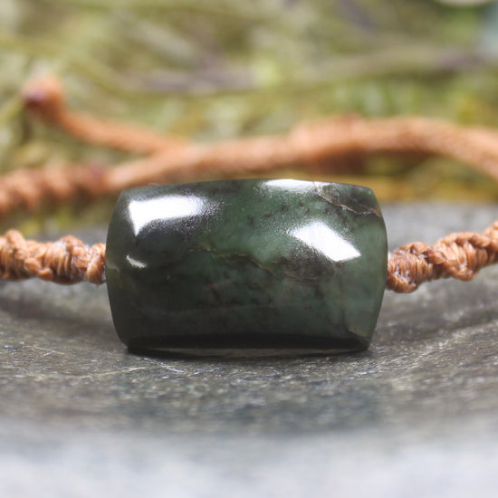 Adjustable cord bracelet with Rimu Pounamu