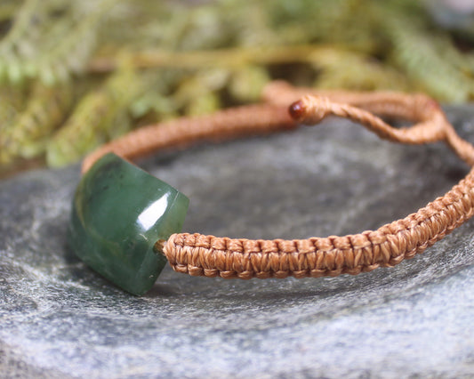 Adjustable cord bracelet with Hapopo Pounamu