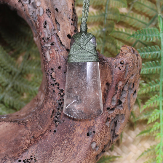 Toki pendant carved from Smokey Quartz
