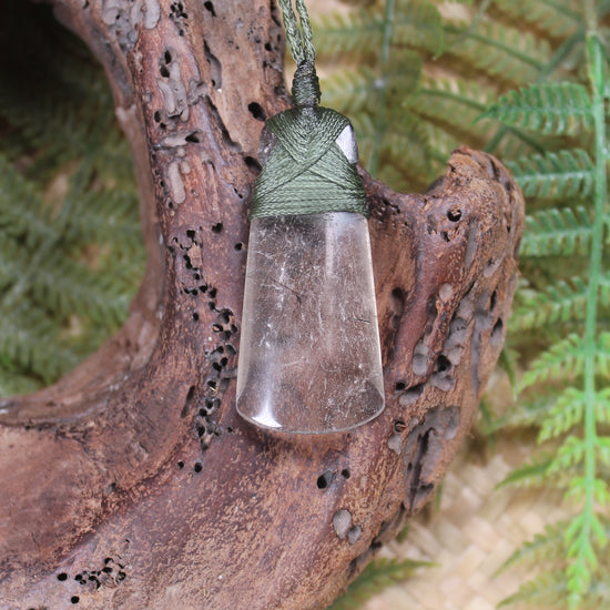 Toki pendant carved from Smokey Quartz