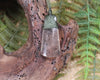 Toki pendant carved from Smokey Quartz