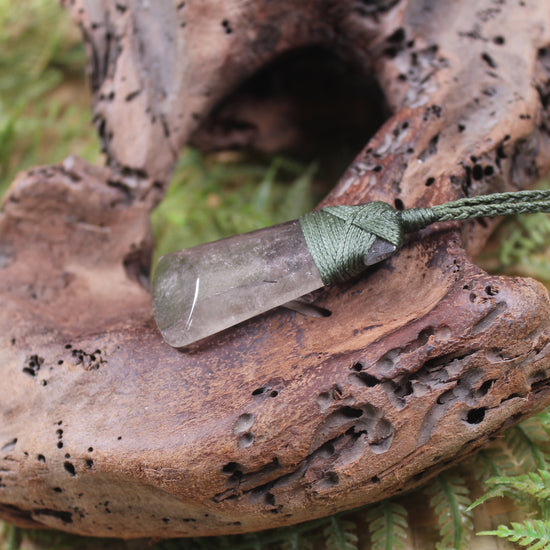 Toki pendant carved from Smokey Quartz