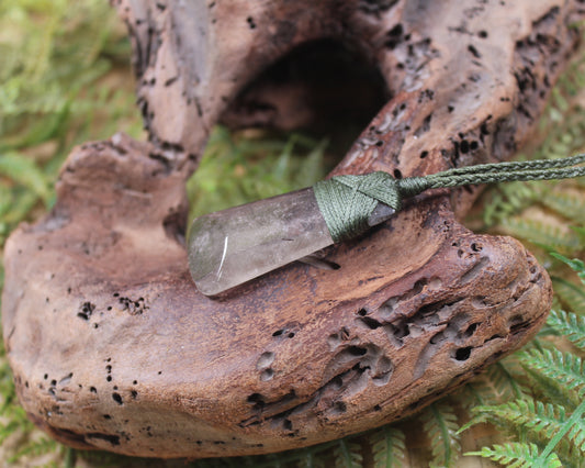 Toki pendant carved from Smokey Quartz