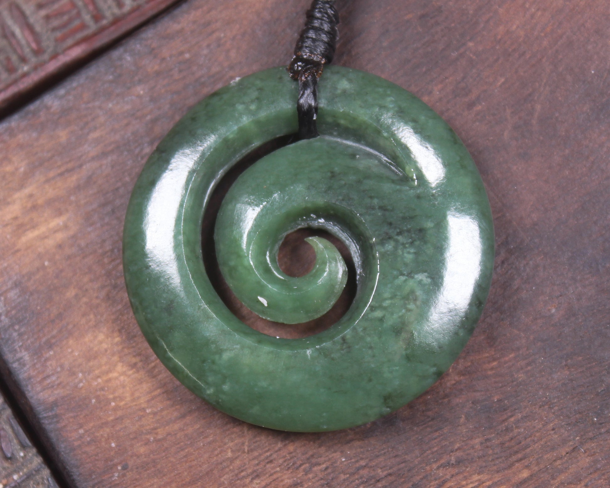 Koru pendant carved from Kawakawa Pounamu - NZ Greenstone