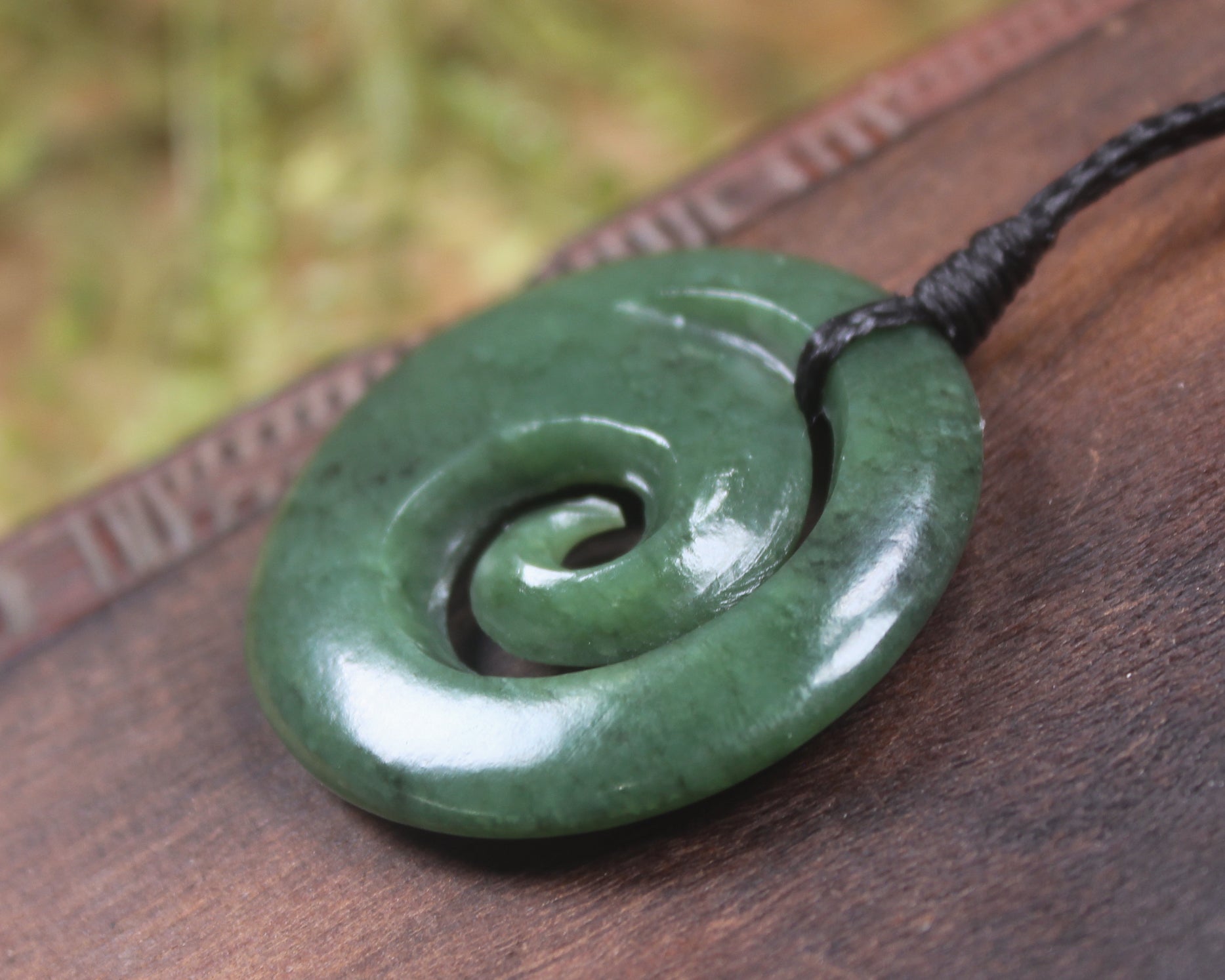 Koru pendant carved from Kawakawa Pounamu - NZ Greenstone