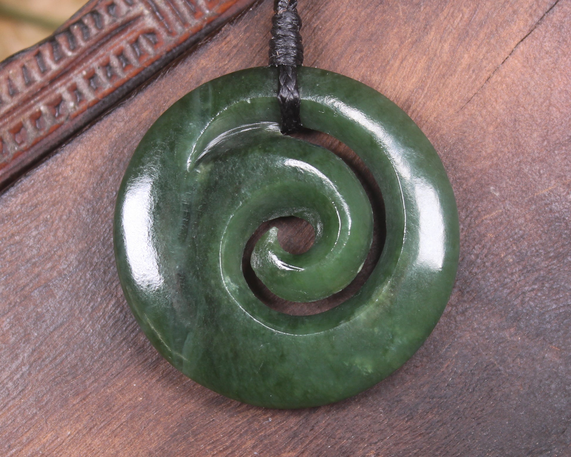 Koru pendant carved from Kawakawa Pounamu - NZ Greenstone