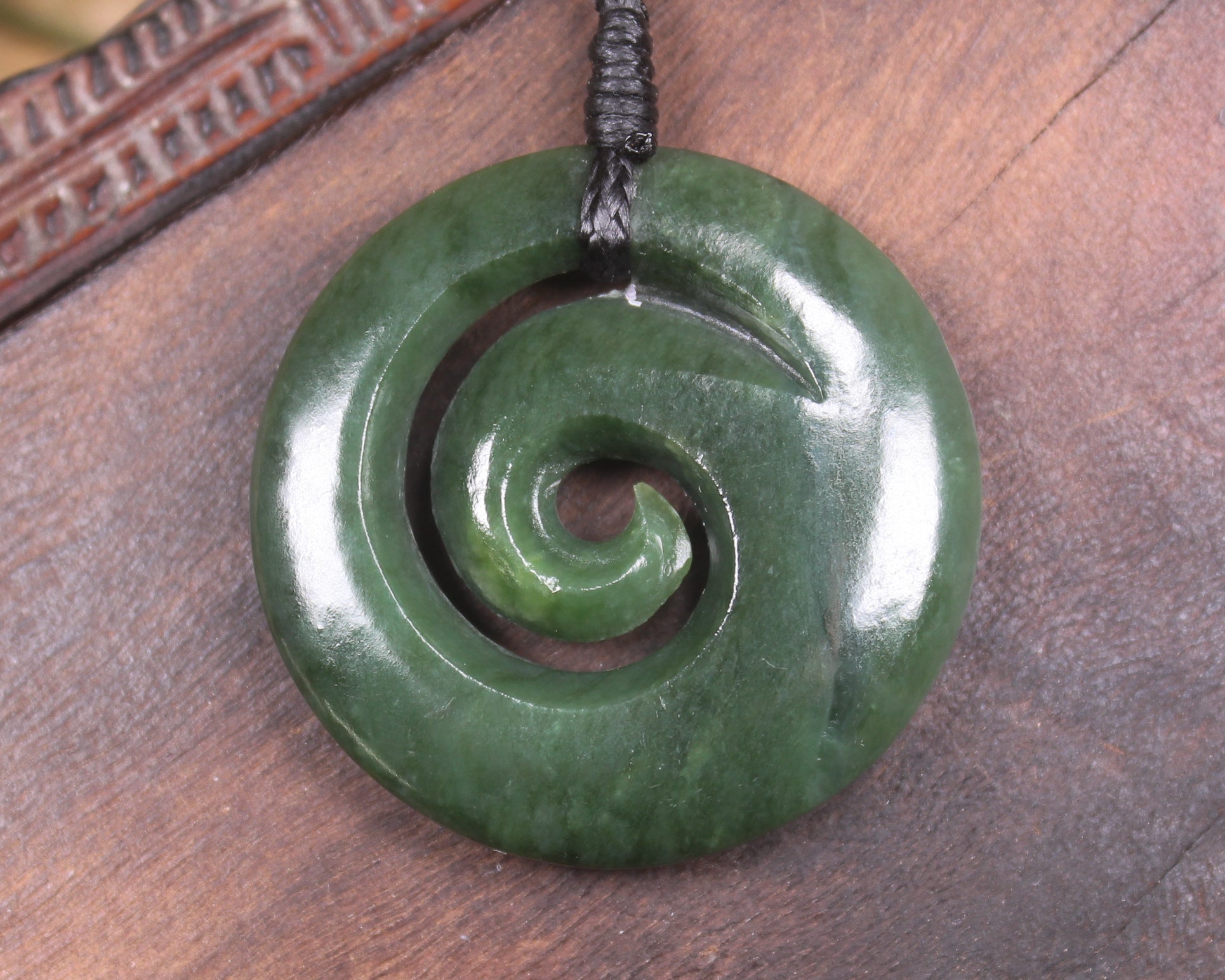 Koru pendant carved from Kawakawa Pounamu - NZ Greenstone